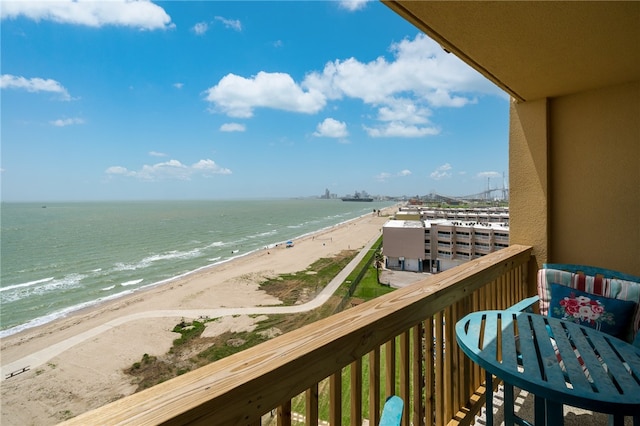 balcony with a view of the beach and a water view