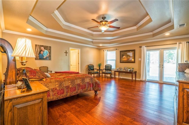 bedroom with access to exterior, dark hardwood / wood-style floors, ornamental molding, a raised ceiling, and ceiling fan