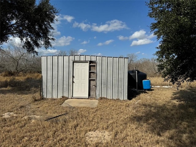 view of outdoor structure with a lawn