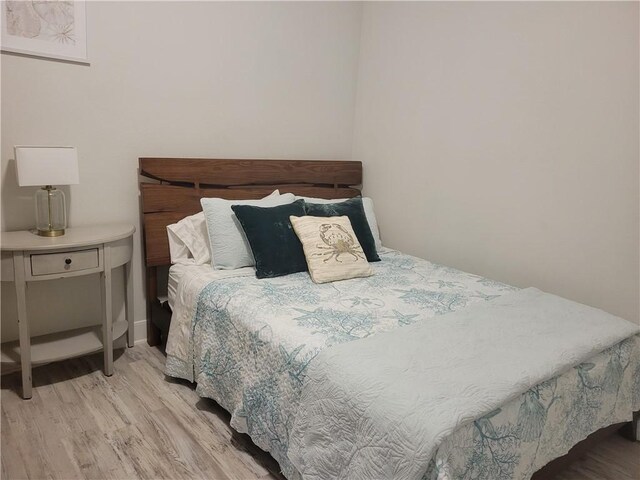 14802 Whitecap Blvd Unit 3-106, Corpus Christi, TX 78418 - bedroom with wood finished floors