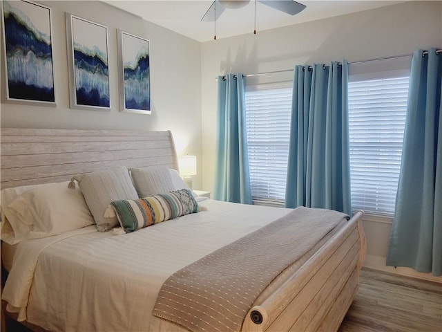 14802 Whitecap Blvd Unit 3-106, Corpus Christi, TX 78418 - bedroom with wood finished floors and a ceiling fan