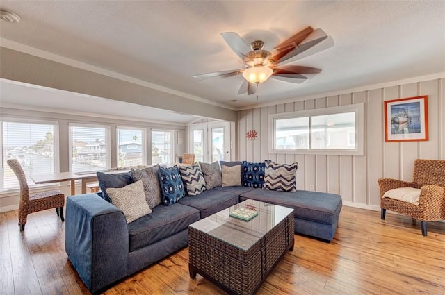 3 Mazatlan Dr, Rockport, TX 78382 - living room with light wood-style flooring, ceiling fan, and ornamental molding
