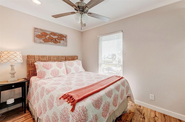 3 Mazatlan Dr, Rockport, TX 78382 - bedroom with light wood finished floors, baseboards, and a ceiling fan