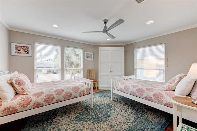 3 Mazatlan Dr, Rockport, TX 78382 - bedroom featuring multiple windows, ornamental molding, wood finished floors, recessed lighting, and a ceiling fan