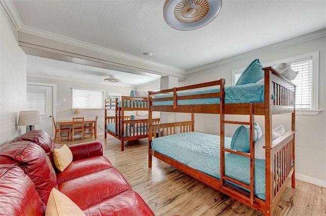 3 Mazatlan Dr, Rockport, TX 78382 - bedroom with wood finished floors, ornamental molding, and baseboards