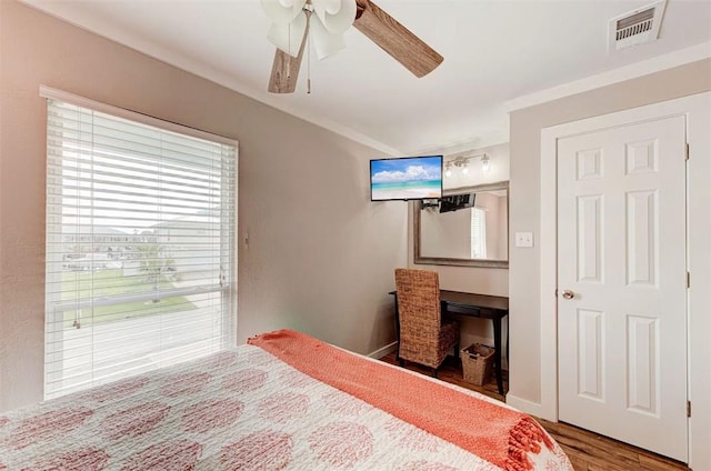 3 Mazatlan Dr, Rockport, TX 78382 - bedroom featuring wood finished floors, crown molding, and ceiling fan