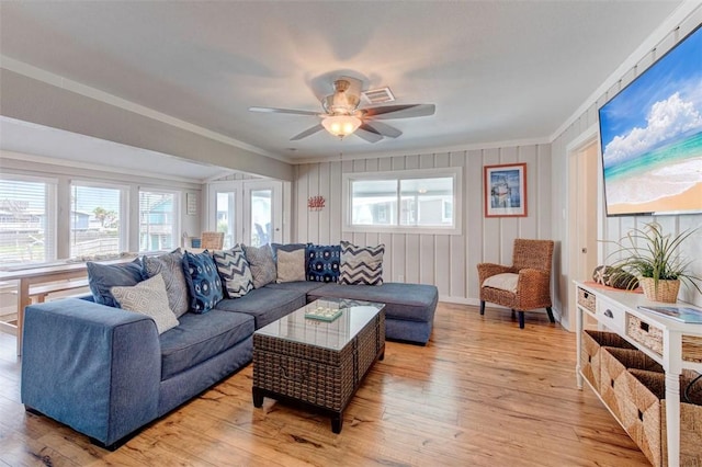 3 Mazatlan Dr, Rockport, TX 78382 - living room with crown molding, light wood-style flooring, and a ceiling fan