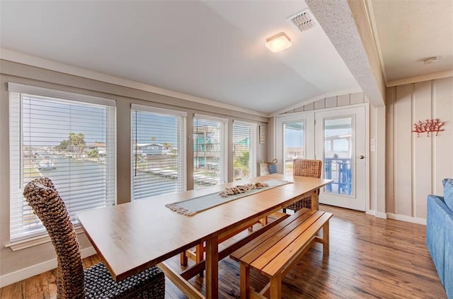 3 Mazatlan Dr, Rockport, TX 78382 - dining area with lofted ceiling, light wood-style floors, and baseboards
