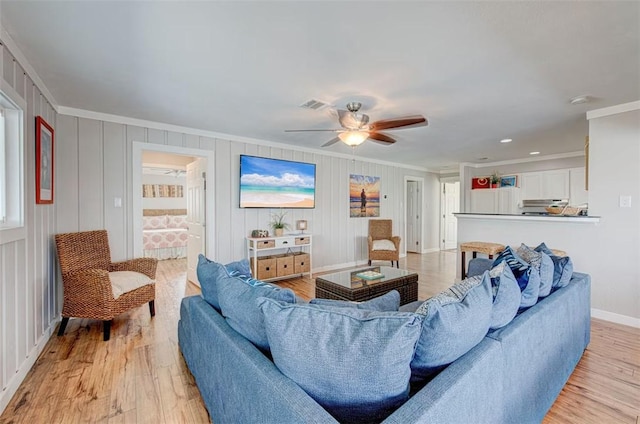 3 Mazatlan Dr, Rockport, TX 78382 - living room featuring ornamental molding, ceiling fan, light wood finished floors, and baseboards