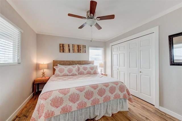 3 Mazatlan Dr, Rockport, TX 78382 - bedroom featuring baseboards, light wood-type flooring, a closet, and ceiling fan