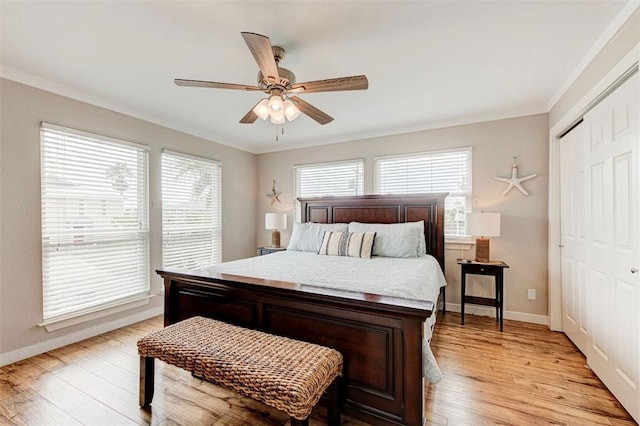 3 Mazatlan Dr, Rockport, TX 78382 - bedroom featuring light wood-type flooring, ornamental molding, a closet, baseboards, and a ceiling fan