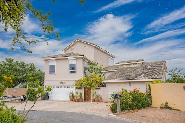 view of front of property with a garage