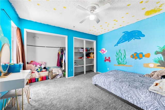 carpeted bedroom featuring a textured ceiling and ceiling fan