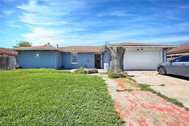 ranch-style home with a garage and a front yard