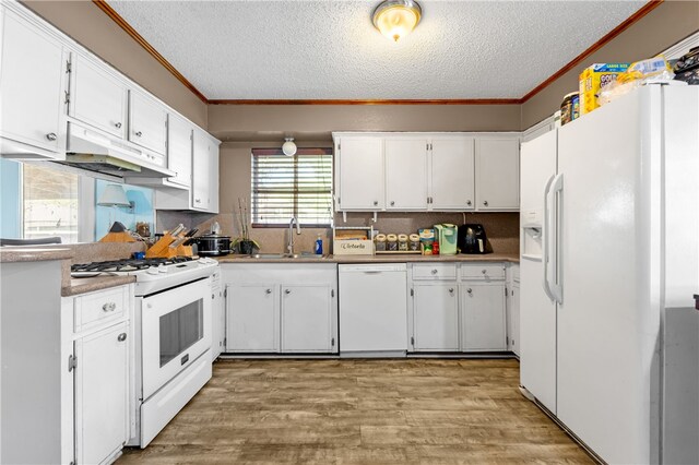 kitchen featuring white cabinets, white appliances, sink, and ornamental molding