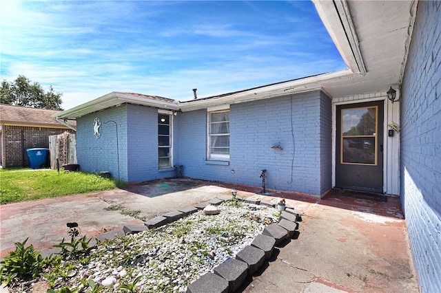 back of property featuring a patio area