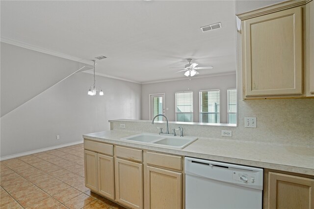 kitchen with dishwasher, light brown cabinets, sink, and crown molding