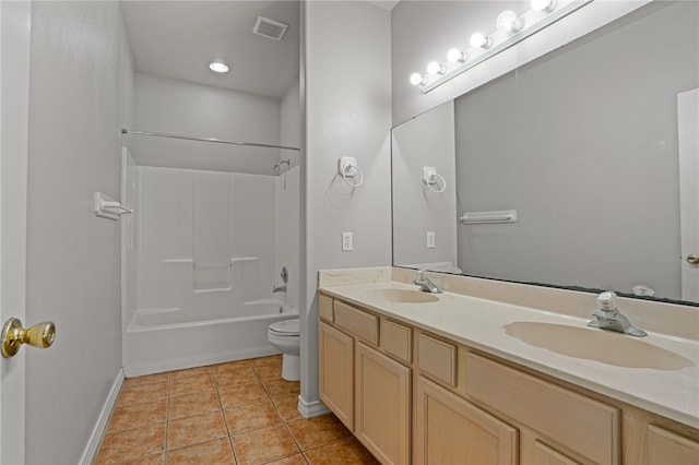 full bathroom with vanity, tile patterned floors, toilet, and shower / washtub combination