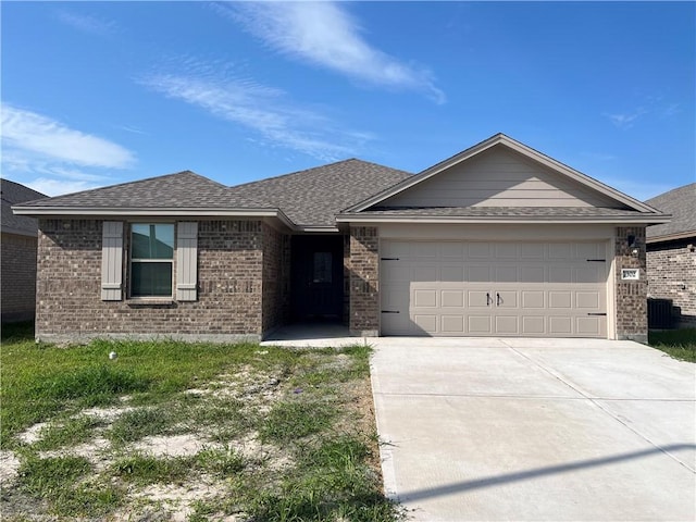 7302 Wilder Ln, Corpus Christi, TX 78414 - single story home featuring brick siding, a garage, concrete driveway, and roof with shingles