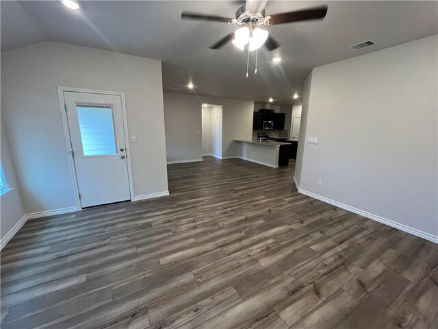 7302 Wilder Ln, Corpus Christi, TX 78414 - unfurnished living room with ceiling fan, dark wood-style flooring, recessed lighting, and lofted ceiling