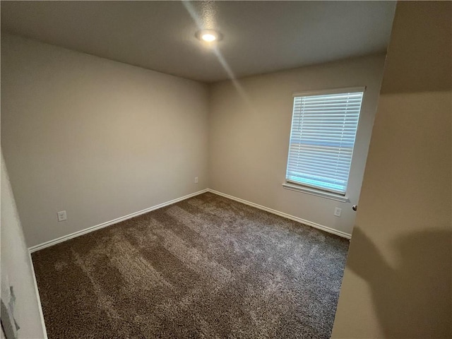 7302 Wilder Ln, Corpus Christi, TX 78414 - empty room with dark colored carpet and baseboards