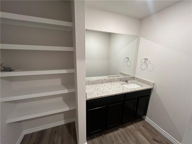 7302 Wilder Ln, Corpus Christi, TX 78414 - bathroom featuring wood finished floors and vanity