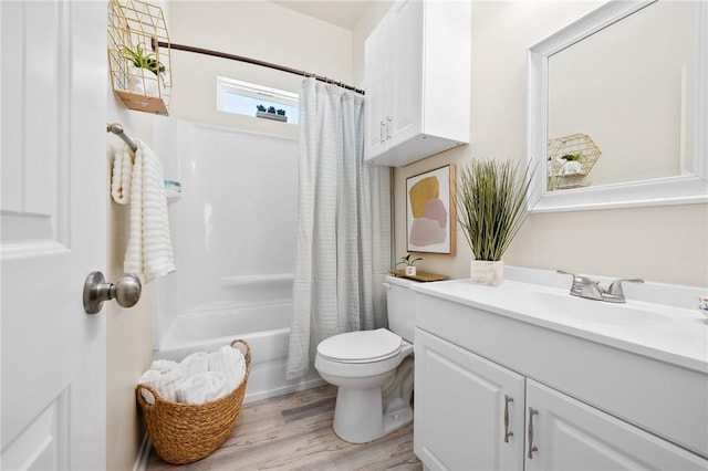 115 N Nautica, Rockport, TX 78382 - bathroom with vanity, toilet, wood finished floors, and shower / bathtub combination with curtain