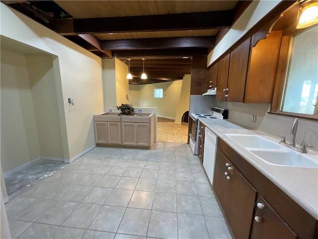 2012 Cochran Ln, Rockport, TX 78382 - kitchen with a sink, white appliances, beam ceiling, light countertops, and light tile patterned floors