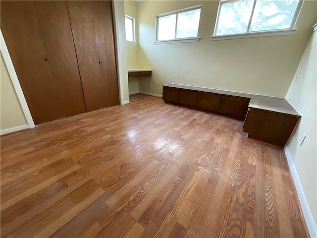 2012 Cochran Ln, Rockport, TX 78382 - unfurnished bedroom with wood finished floors, baseboards, and a closet