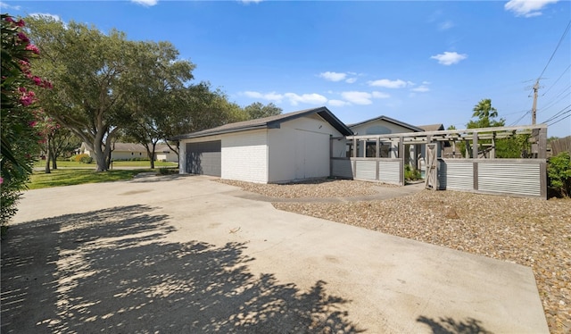 view of side of property with an outbuilding and a garage