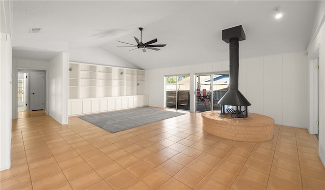 unfurnished living room featuring lofted ceiling, light tile patterned floors, and ceiling fan