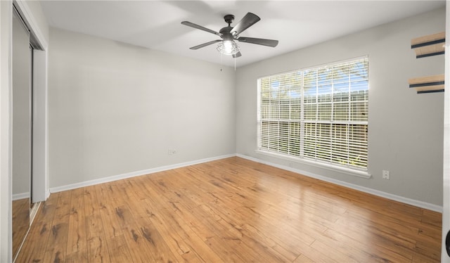 unfurnished room featuring ceiling fan and light hardwood / wood-style flooring