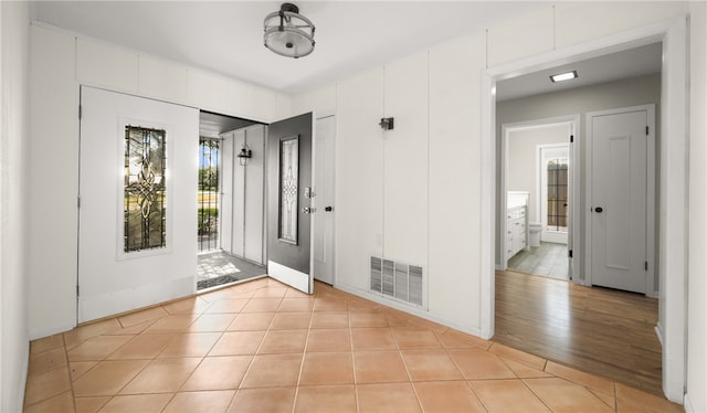 foyer entrance featuring light wood-type flooring