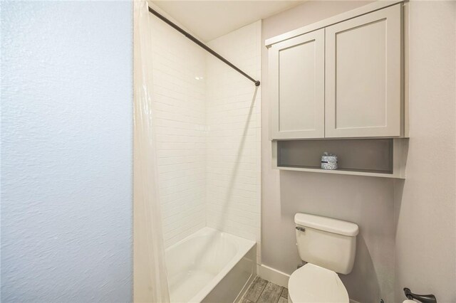 70 Belaire Dr, Rockport, TX 78382 - full bath with toilet, wood finished floors, and tub / shower combination