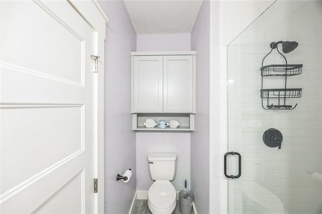 70 Belaire Dr, Rockport, TX 78382 - bathroom with baseboards, a stall shower, and toilet
