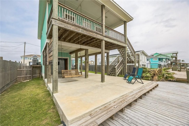 70 Belaire Dr, Rockport, TX 78382 - view of patio / terrace featuring fence, a wooden deck, a carport, and stairway