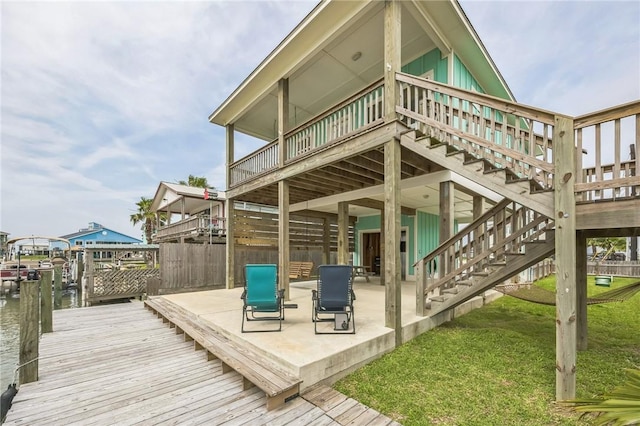 70 Belaire Dr, Rockport, TX 78382 - back of house featuring fence, a patio, a yard, and a deck