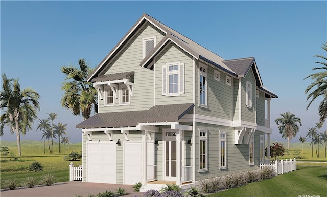 view of front of property with a garage and a front yard