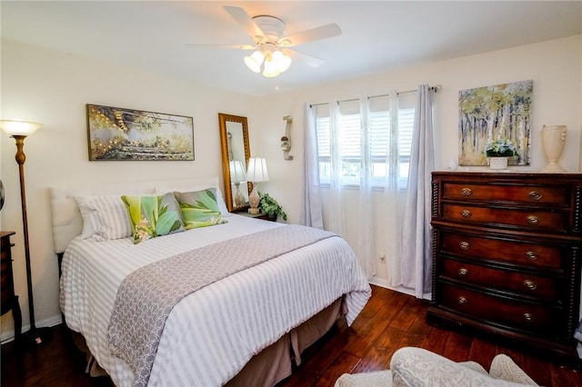 bedroom with dark hardwood / wood-style floors and ceiling fan