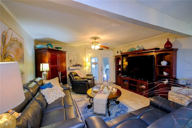 tiled living room with ceiling fan and crown molding