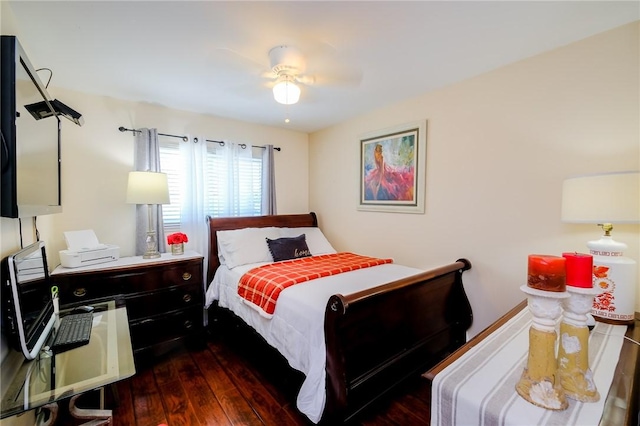 bedroom with ceiling fan and dark hardwood / wood-style floors