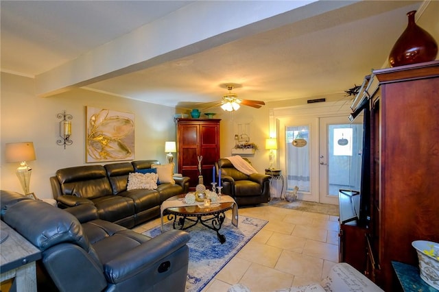 tiled living room with french doors and ceiling fan