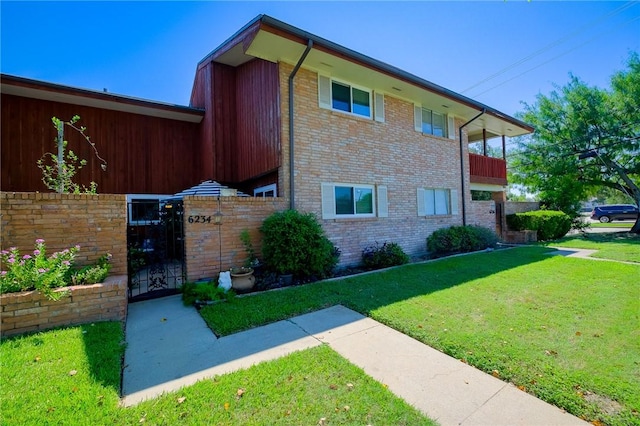 view of home's exterior with a lawn