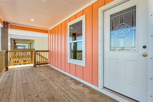 view of exterior entry with board and batten siding