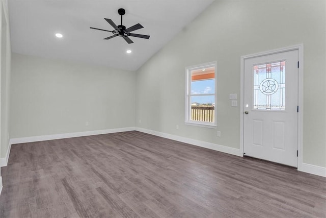 foyer featuring baseboards, ceiling fan, wood finished floors, high vaulted ceiling, and recessed lighting