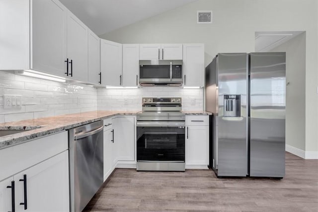 kitchen featuring light wood-style flooring, white cabinetry, and stainless steel appliances