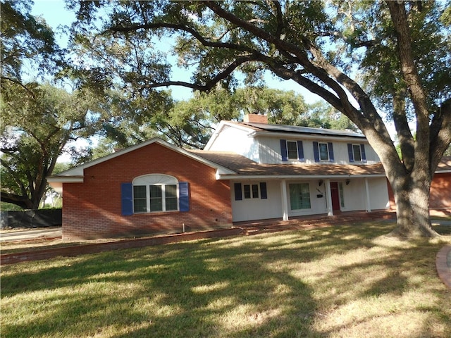 view of front of house with a front lawn