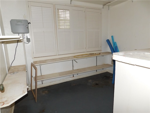 basement with white refrigerator