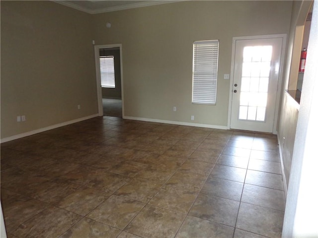 tiled spare room with crown molding