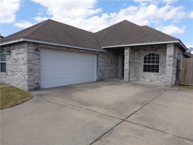 ranch-style house featuring a garage